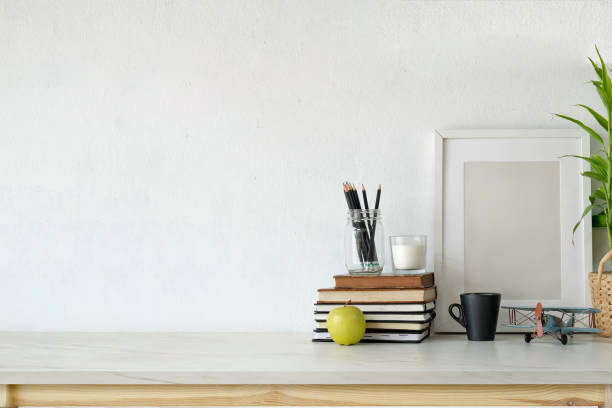 istock Desk workspace with mockup blank poster, supplies and copy space. 1046808040
