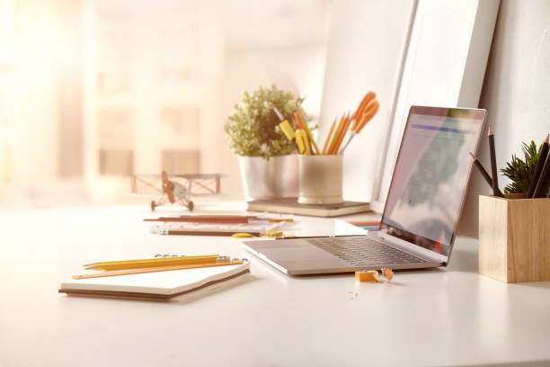 istock Office desk with laptop computer and business office background. 1046808044