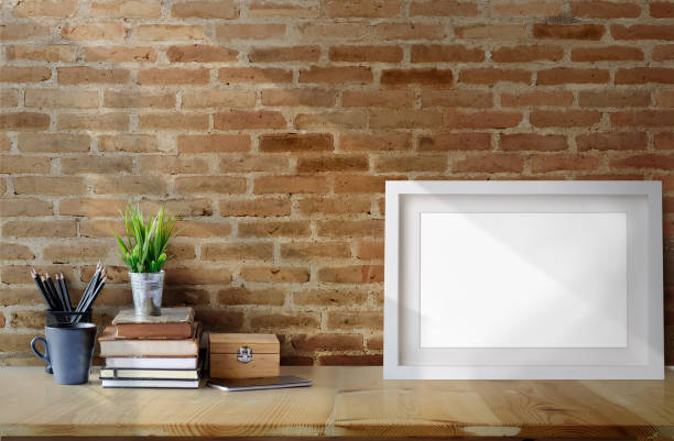 istock Desk workspace with mockup blank poster, supplies and copy space. 1046808056