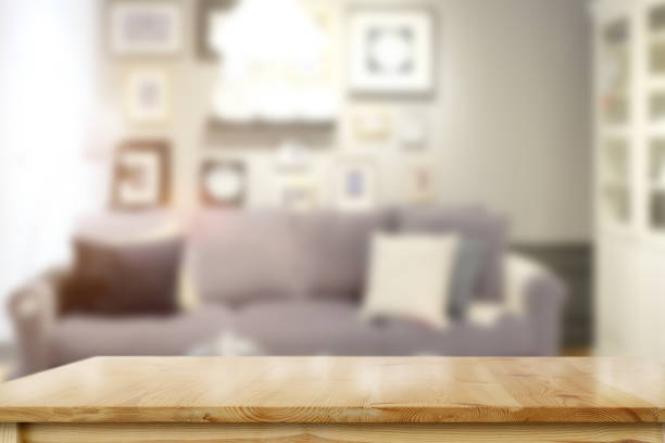 istock Empty wooden table over living room background. 1046808090