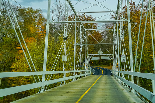 Dingmans Ferry Bridge across the Delaware River in the Poconos Mountains, connecting the states of Pennsylvania and New Jersey, USA