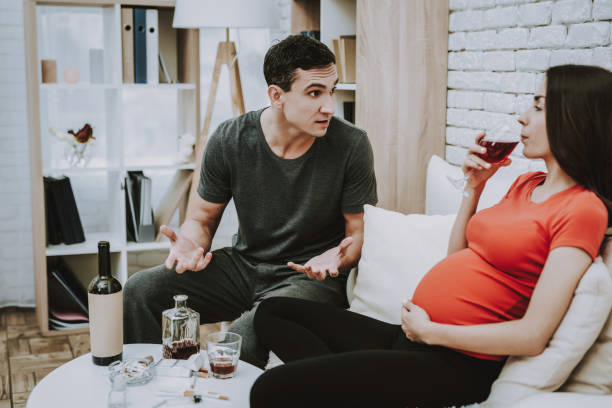 istock Man Quarrels. Pregnant Girl . Drinks Alcohol. 1046832950