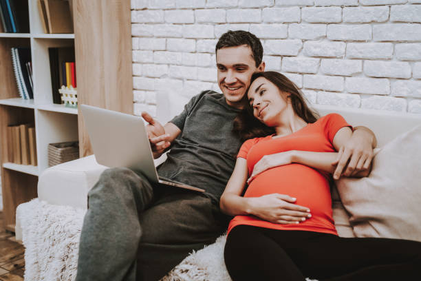 istock Laptop. Parenthood. Sweet. Domestic Life. Sofa. 1046833026