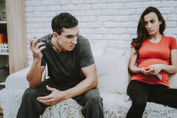 istock Husband. Man Smoking Cigarette. Depressed. Couch. 1046833062