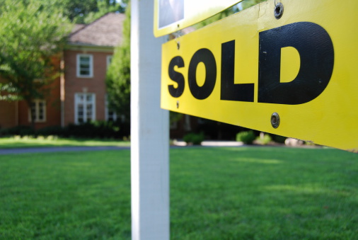 House sold, a rare sign among dozens of houses for sale in an upscale U.S. East Coast residential neighborhood.