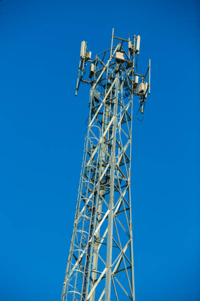 istock Mobile receiver and transmitter antenna tower,antenna tower building with the blue sky. 1046840538