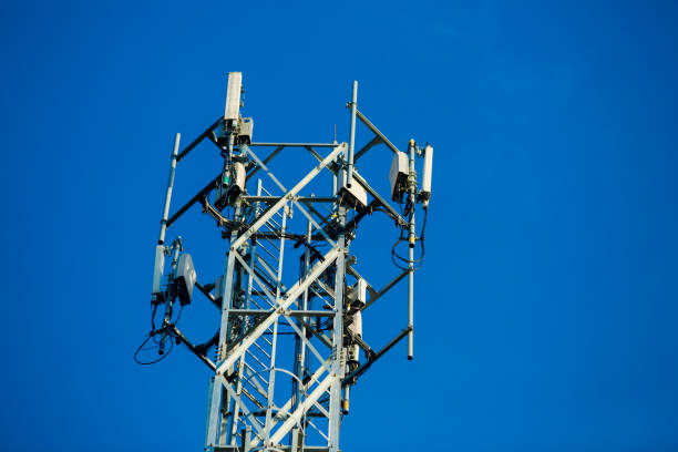 istock Mobile receiver and transmitter antenna tower,antenna tower building with the blue sky. 1046840654