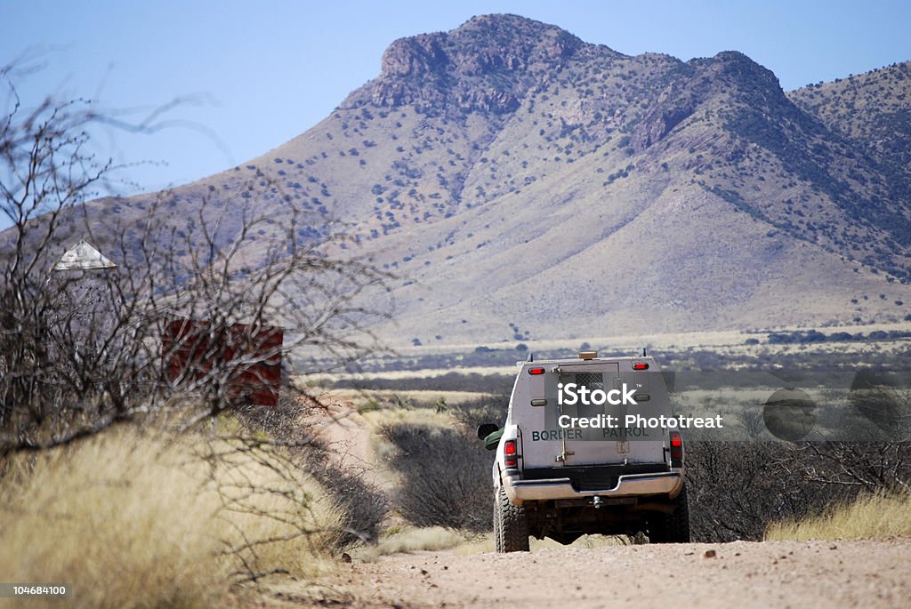Border patrol truck with mountains  Geographical Border Stock Photo