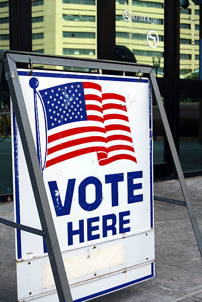 istock Vote here sign in downtown 104684132