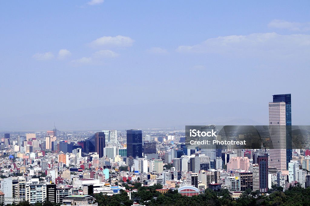 A Mexico City skyline with tall buildings on the horizon The business district of Mexico City, skyscrapers lining Paseo de la Reforma street, with the historic downtown behind. Torre Mayor, the highest skyscraper in Latin America on the right. The sky is unusually clear and free of smog because of a citywide shutdown ordered by the Mexican government as a result of the H1N1 influenza epidemic. Mexico City Stock Photo