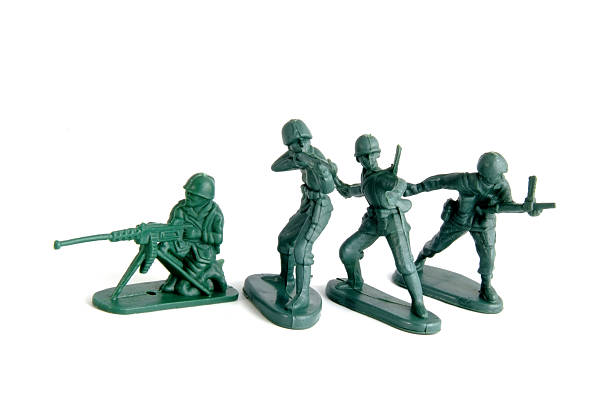 istock Four toy soldiers isolated on white 104684860