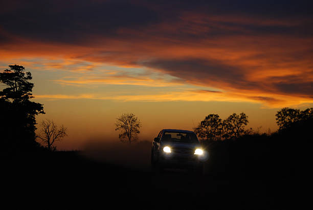 istock Car racing through forest at sunset 104685135