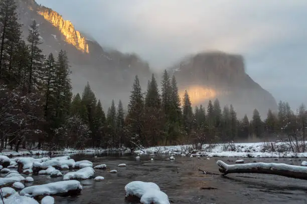 Evening Sun Rays falling on El Capitan and other mountains at Yosemite Valley in winter, California, USA