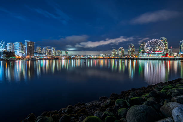 istock Vancouver night skyline with Science World reflecting in water 1046859570
