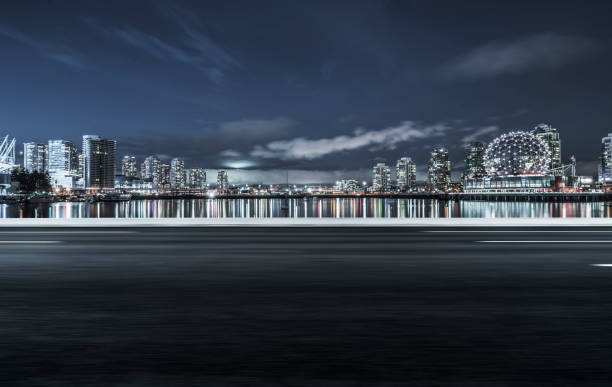 istock Vancouver downtown skyline with tarmac road on foreground 1046859606
