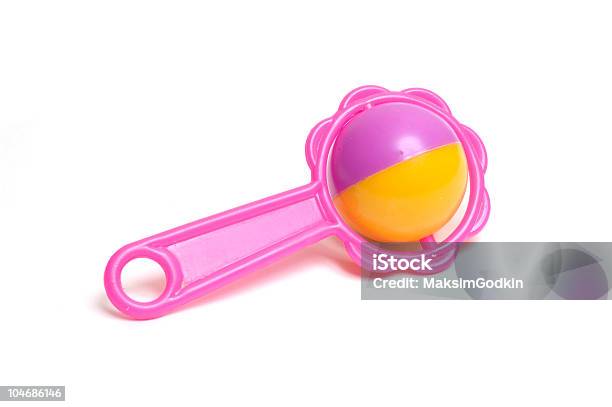 A Pink And Yellow Toy On A White Background Stock Photo - Download Image Now - Toy Rattle, Baby - Human Age, Color Image