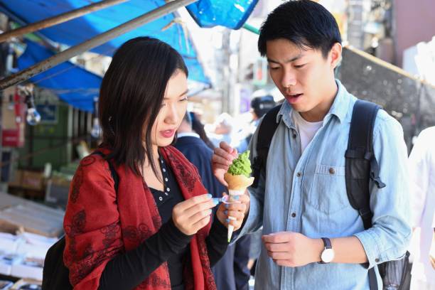 istock Young couple sharing an ice cream 1046869248