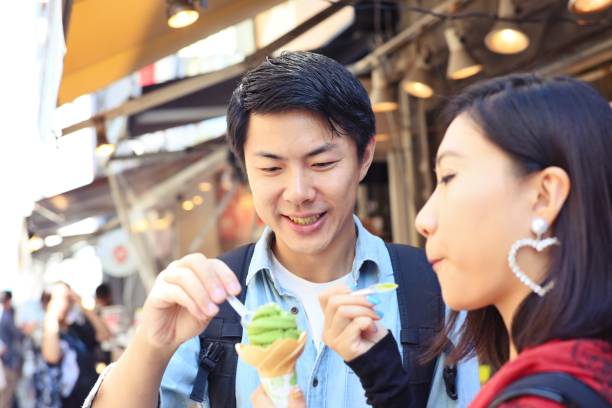 istock Young couple sharing an ice cream 1046869308