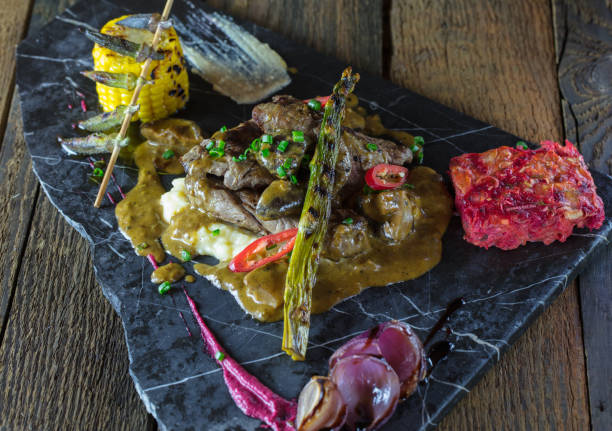 istock grilled meat on wooden back ground 1046869598