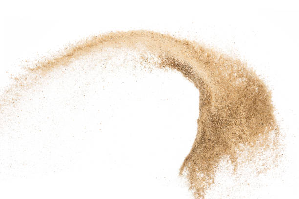 istock Sand flying explosion isolated on white background ,throwing freeze stop motion object design 1046872294