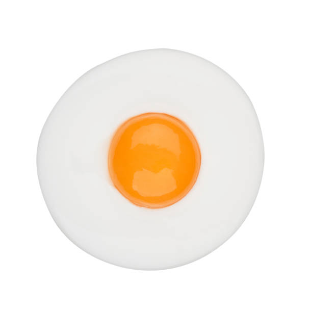istock Fried egg isolated circle shape on white background on top view  food cooking photo object design 1046878136