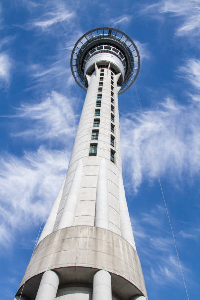 istock Sky Tower skyline in Auckland on a blue sky with white clouds 1046880430