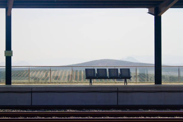 istock Empty seats in rural lonely train station. 1046880486