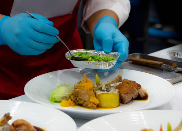 istock Chef preparing food, meal, in the kitchen, chef cooking, Chef decorating dish, closeup, chef at work 1046880908