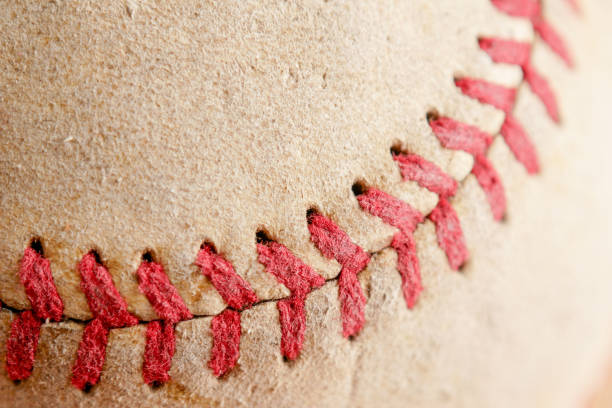 istock Sports Equipment old Baseball background texture 1046894738
