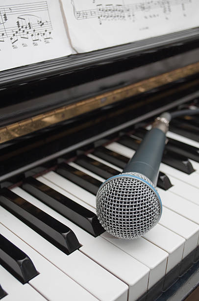 istock Microphone on the keyboard of piano 104689583