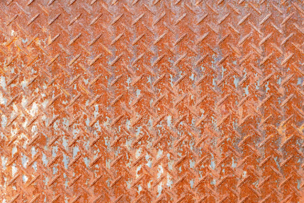 istock Rusted diamond steel plate background texture 1046897560