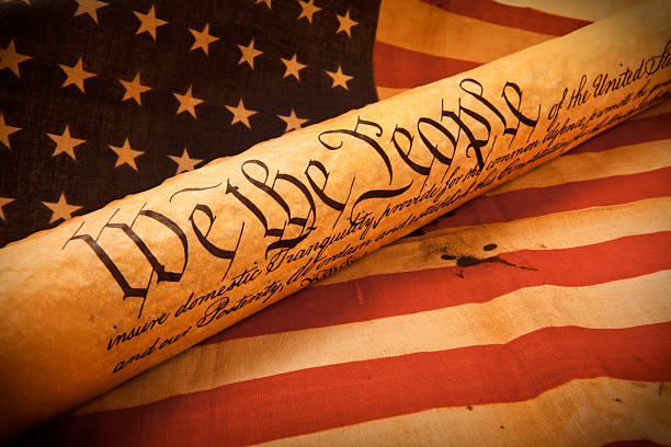 US Constitution - We The People   with USA  Flag. stock photo