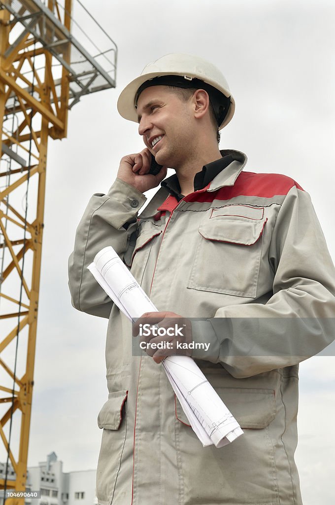 Construcción en sitio de construcción con teléfono - Foto de stock de Accesibilidad libre de derechos