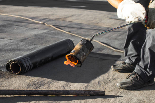 istock Roll roofing Installation with propane blowtorch during construction works 1046909266