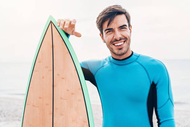 istock Portrait of a smiling surfer 1046909466
