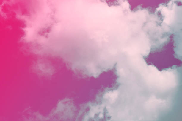 istock Nature background. Fluffy soft clouds in sky toned. 1046911598