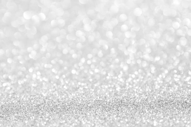 istock abstract background white Silver lights on christmas bokeh 1046912034