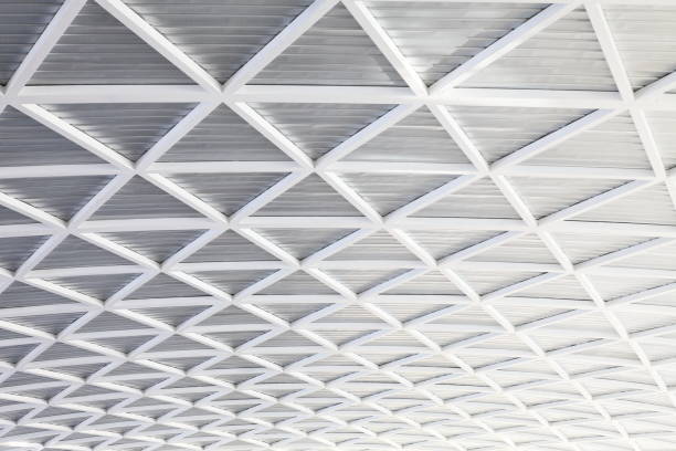istock Futuristic bright metallic black and white abstract curved geometrical roof design and pattern 1046912048