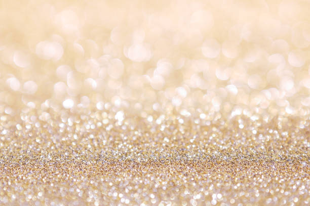 istock abstract background gold light bokeh christmas holiday 1046912104