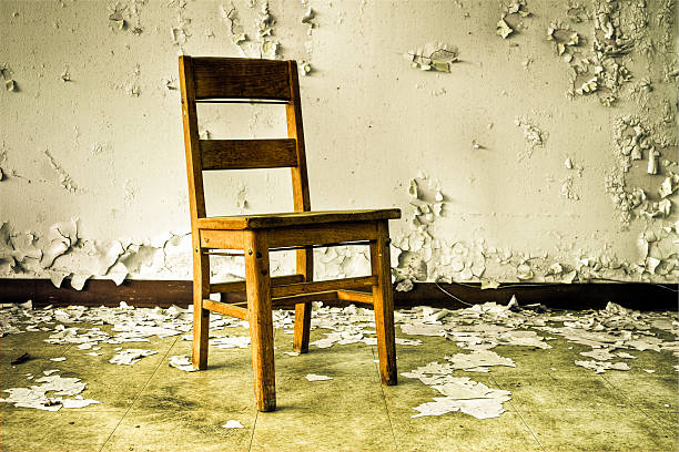 Wooden Chair in Abandoned Building stock photo