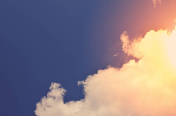 istock Nature background. Fluffy soft clouds in sky toned. 1046917144