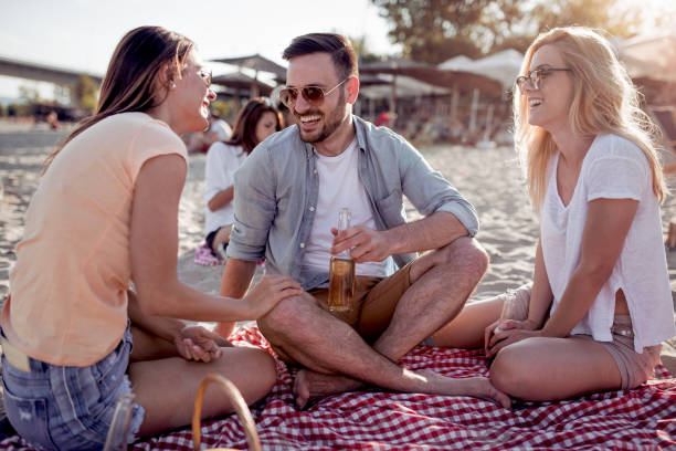 istock Friends having fun on the beach 1046922406