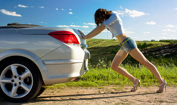 istock Woman is pushing broken car 104692432