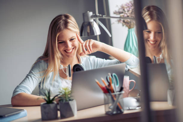 istock Young woman working from home office 1046925630