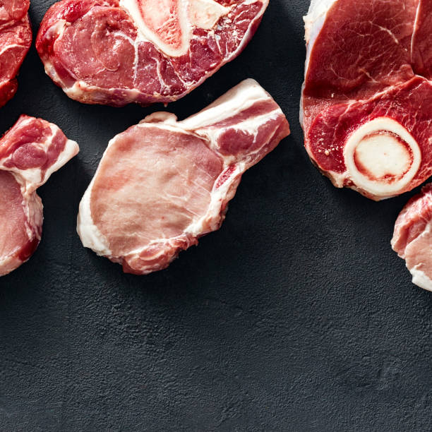 istock Set different meats pork and beef copy space top view 1046929036