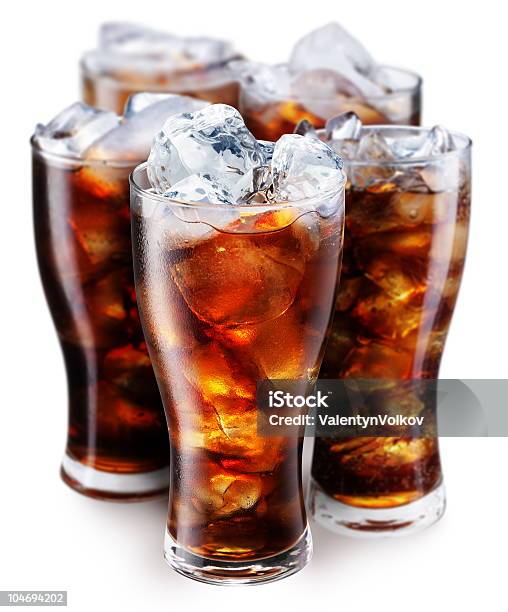 Pint Glasses Full Of Cola With Ice On A White Background Stock Photo - Download Image Now