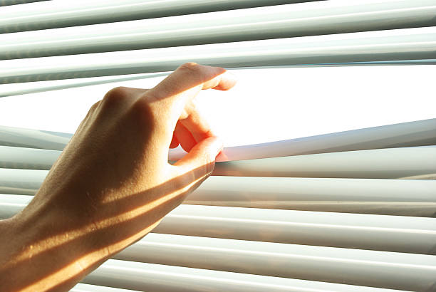 istock Hand open the jalousie. 104694216