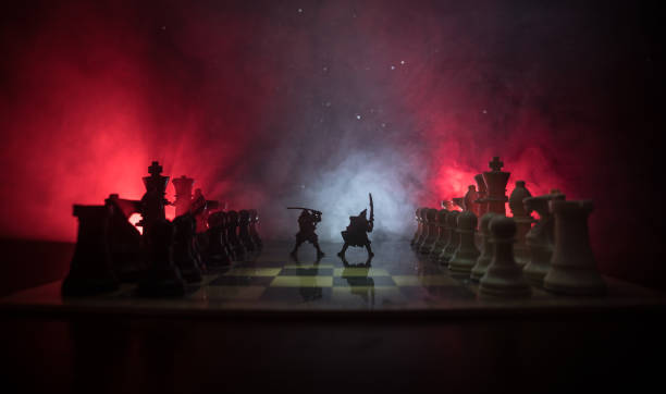 istock Medieval battle scene with cavalry and infantry on chessboard. Chess board game concept of business ideas and competition and strategy ideas Chess figures on a dark background 1046954754