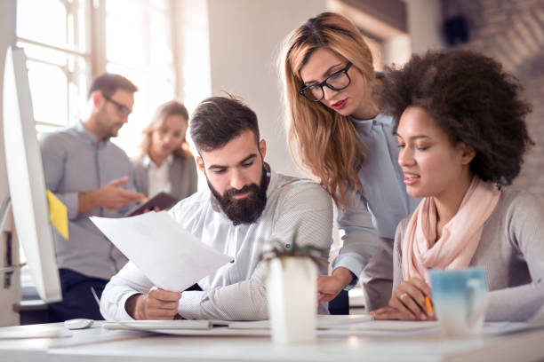 istock Business team sitting in office and planning work 1046957554