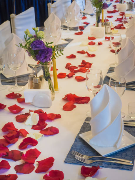istock Table served with glasses and rose petals. 1046958268
